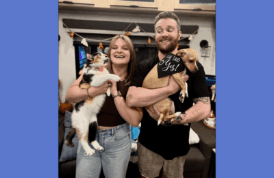 Dylan Henry, a North Texas health insurance agent, is pictured outdoors with two dogs.